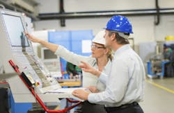 Engineers Working On Industrial Control System Engineers Working On Industrial Control System