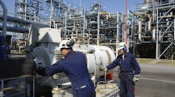 Technicians Inspecting Pumps Technicians Inspecting Pumps