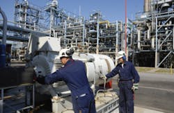Technicians Inspecting Pumps Technicians Inspecting Pumps