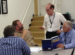 David W. Spitzer chats with attendees at the Industrial Flow Measurement Seminar. (Photo courtesy of Matt Migliore)
