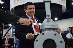 Crane President Alex Alcala cuts Crane’s 160th anniversary cake in the shape of the new Pacific CSV gate valve at Valve World Americas Expo. (Courtesy Crane ChemPharma & Energy) Crane President Alex Alcala cuts Crane’s 160th anniversary cake in the shape of the new Pacific CSV gate valve at Valve World Americas Expo. (Courtesy Crane ChemPharma & Energy)