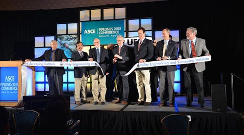 ASCE&rsquo;s President Robert D. Stevens, Ph.D., P.E., F.ASCE (cutting ribbon) and inaugural UESI President Randall C. Hill, P.E., F.ASCE (to left of Stevens )unveiled the new Utility Engineering and Surveying Institute in a ribbon-cutting ceremony Aug. 24 at ASCE&rsquo;s 2015 Pipelines Conference in Baltimore, Maryland. (Photo courtesy: ASCE)