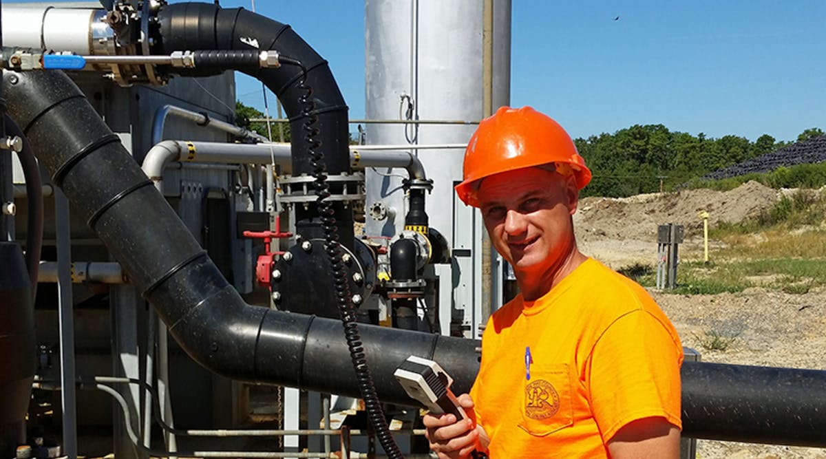 Randy Handlovsky using his Sage Prism to measure landfill gas before combustion.