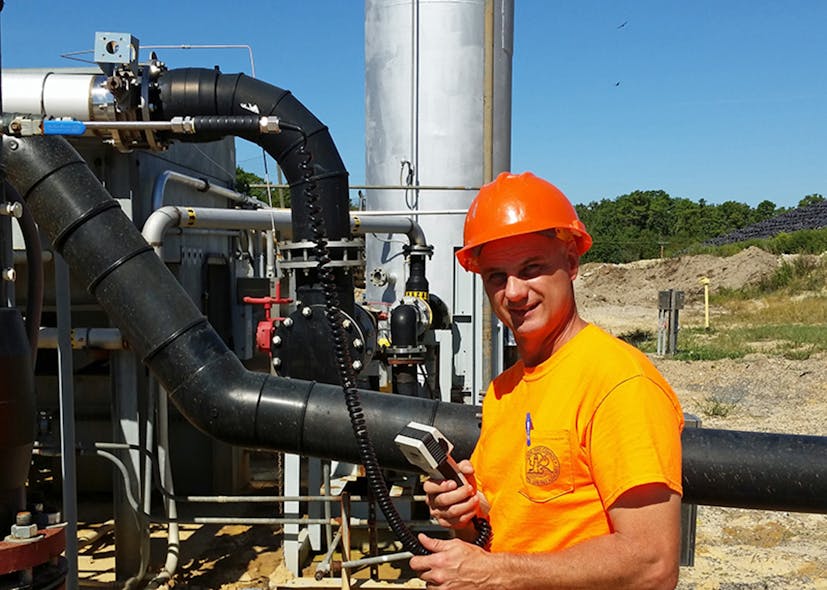 Randy Handlovsky using his Sage Prism to measure landfill gas before combustion.