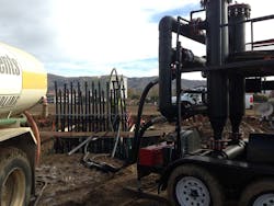 Installation of the header manifold. The systems uses 10 header pairs, each pair serves 10 borehole circuits each. Image courtesy of Vance Brown Builders