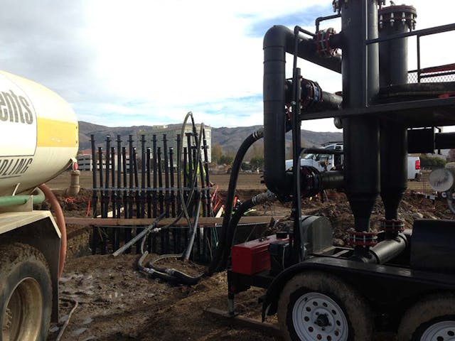 Installation of the header manifold. The systems uses 10 header pairs, each pair serves 10 borehole circuits each. Image courtesy of Vance Brown Builders