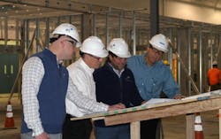 NewAge Industries building renovations. From left to right: Glenn VandeGrift of AES Clean Technologies, Bob Volk of NewAge Industries, Rob Satterfield of AES Clean Technologies and Ken Baker of NewAge Industries