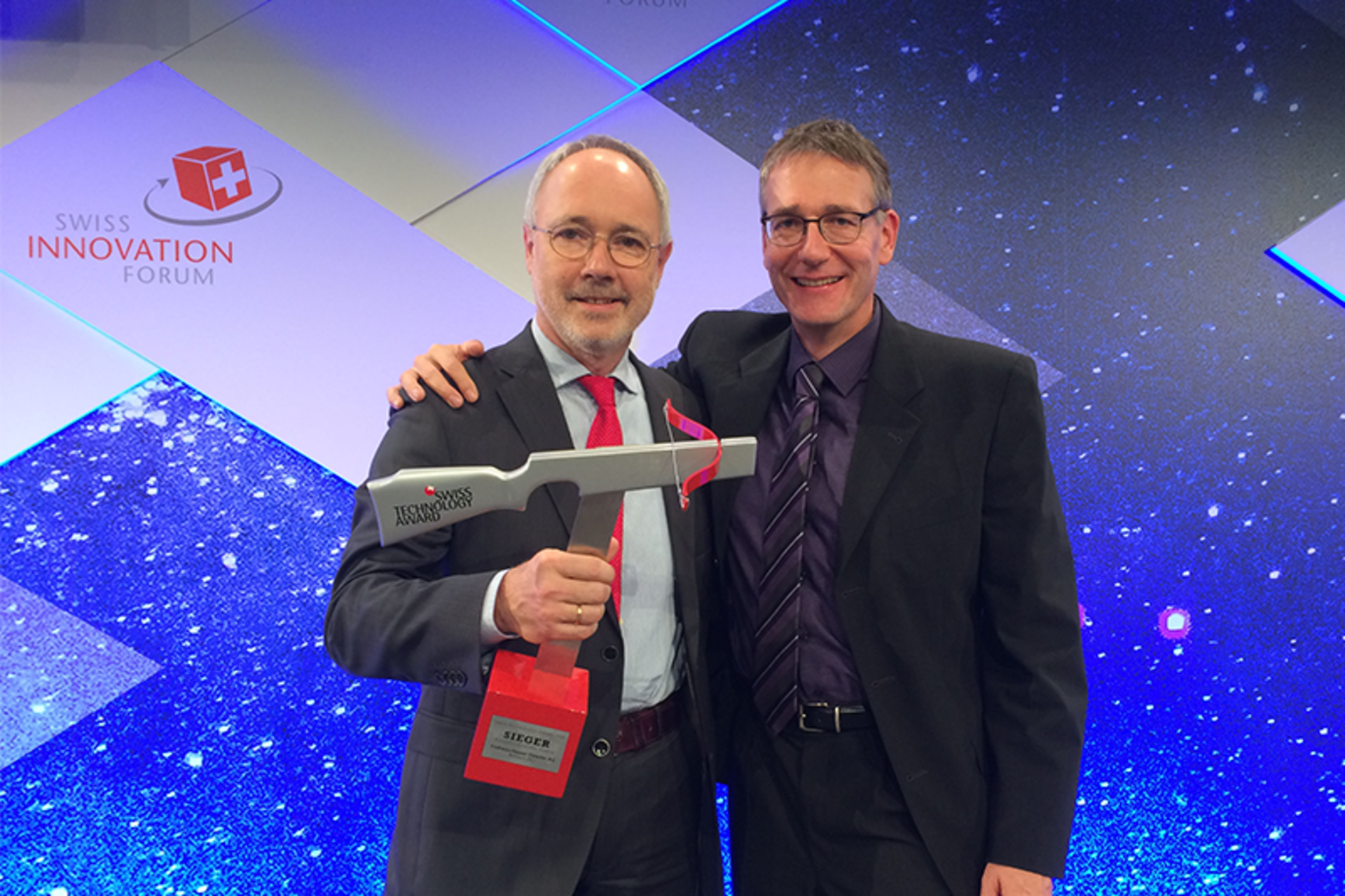 Endress+Hauser developers Dr. Wolfgang Drahm (left) and Dr. Martin Anklin (right) with the Swiss technology award. Image courtesy of Endress+Hauser