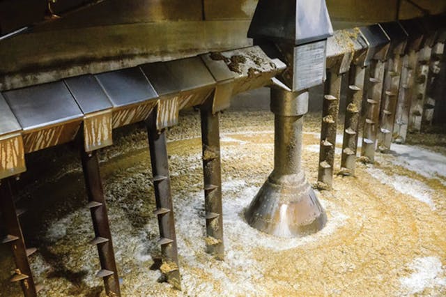 Inside a mash tun while making whisky. MartinM303/iStock