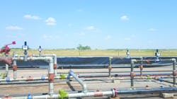 Figure 3. Shown is a set of wireless flow totalizers connected to turbine flowmeters to monitor water and oil flow rates within pipelines. In this upstream oil and gas application, two units on the left count water rate while those on the right count oil. The flow totalizers show field displays of flow rates and totals, providing continuous real-time information instead of snapshot views. Data and diagnostics are available locally using the display of the battery-powered flow totalizer as well as remotely from a gateway using Modbus standard protocol. Figure 3. Shown is a set of wireless flow totalizers connected to turbine flowmeters to monitor water and oil flow rates within pipelines. In this upstream oil and gas application, two units on the left count water rate while those on the right count oil. The flow totalizers show field displays of flow rates and totals, providing continuous real-time information instead of snapshot views. Data and diagnostics are available locally using the display of the battery-powered flow totalizer as well as remotely from a gateway using Modbus standard protocol.