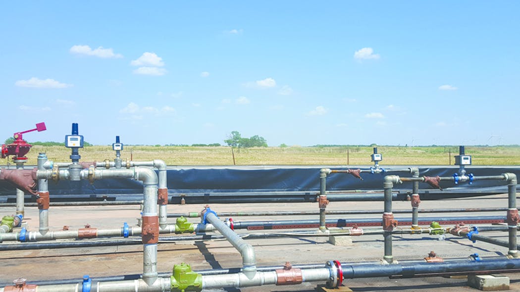 Figure 3. Shown is a set of wireless flow totalizers connected to turbine flowmeters to monitor water and oil flow rates within pipelines. In this upstream oil and gas application, two units on the left count water rate while those on the right count oil. The flow totalizers show field displays of flow rates and totals, providing continuous real-time information instead of snapshot views. Data and diagnostics are available locally using the display of the battery-powered flow totalizer as well as remotely from a gateway using Modbus standard protocol.