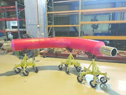 Thermoplastic thermal insulation and corrosion protection system coated on a pipe bend Thermoplastic thermal insulation and corrosion protection system coated on a pipe bend