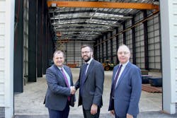 TUV NEL&rsquo;s completed base building that will house its Advanced Multiphase Facility. Pictured from left to right: Brian Austin, CEO, TUV SUD U.K. &amp; Ireland; Matt Bellshaw, property director &ndash; HFD Property Group Limited; William McKnight, chief financial officer, TUV SUD U.K. &amp; Ireland. Graphic courtesy of TUV SUD NEL