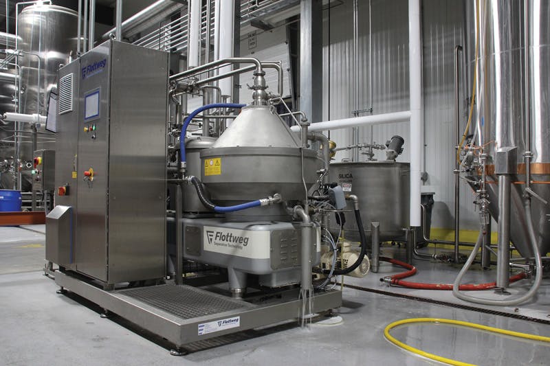 The centrifuge system separates the liquid and sends it to a holding tank before filtration.