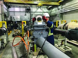 Figure 2. Orifice plate being removed for inspection and possible replacement to different beta ratio. Figure 2. Orifice plate being removed for inspection and possible replacement to different beta ratio.