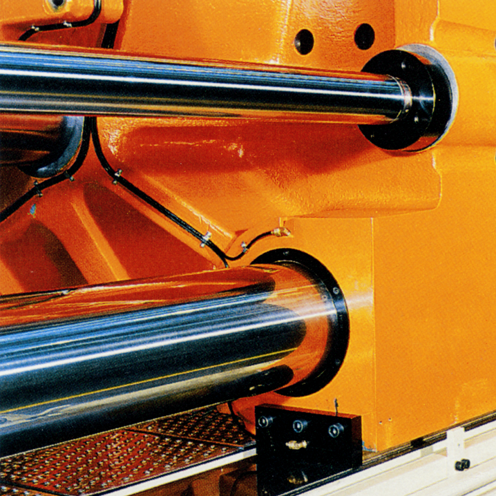 Closeup of hydraulic cylinders on industrial equipment where proper surface finish is critical for a long service life.