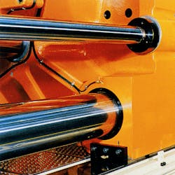 Closeup of hydraulic cylinders on industrial equipment where proper surface finish is critical for a long service life. Closeup of hydraulic cylinders on industrial equipment where proper surface finish is critical for a long service life.