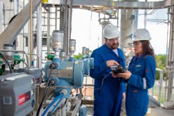 Figure 1. The cylindrical devices shown here — Emerson THUM wireless modules — are installed on Coriolis flowmeters. Figure 1. The cylindrical devices shown here — Emerson THUM wireless modules — are installed on Coriolis flowmeters.