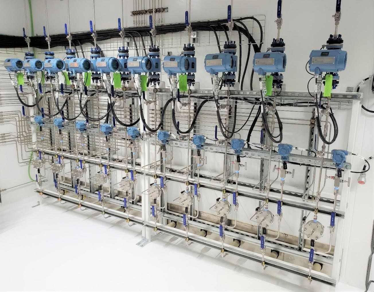 Figure 1. In this water injection skid with multiple flow control systems for dosing freshwater at the base of oil wells in the Bakken Basin of North Dakota, the lower row of components are stainless steel direct-sealing diaphragm valves.