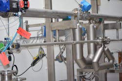 Coriolis flowmeters mounted in a flow calibration facility in Europe.