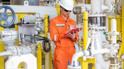 Figure 1. An operator checks and logs the value of a differential pressure gauge. Figure 1. An operator checks and logs the value of a differential pressure gauge.